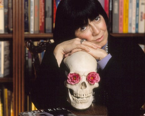a woman leans on a skull with flowers in its eye sockets