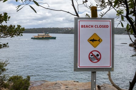 A ferry sails past a closed beach at Vaucluse in Sydney.