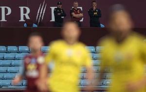 Dean Smith and John Terry watch from the stand.