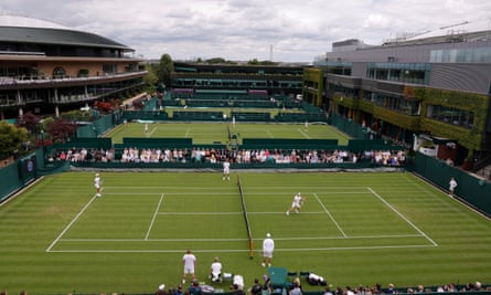 Players including Andy Murray and Novak Djokovic warm up at Wimbledon