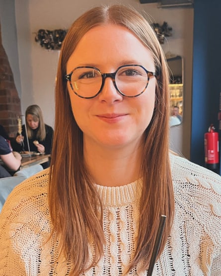 Jess Rushton standing for a candid photo holding a cocktail