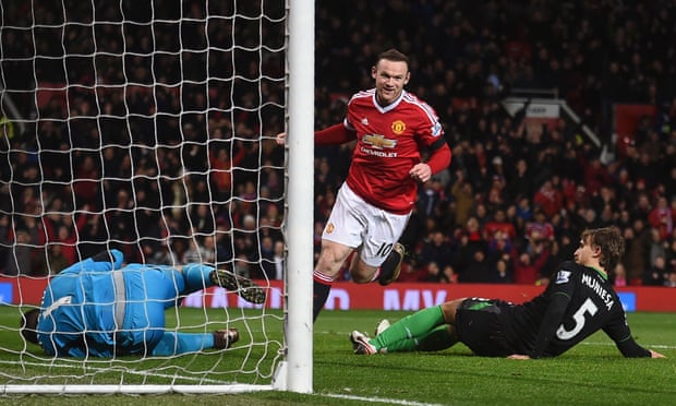 Wayne Rooney wheels away in celebration after scoring.