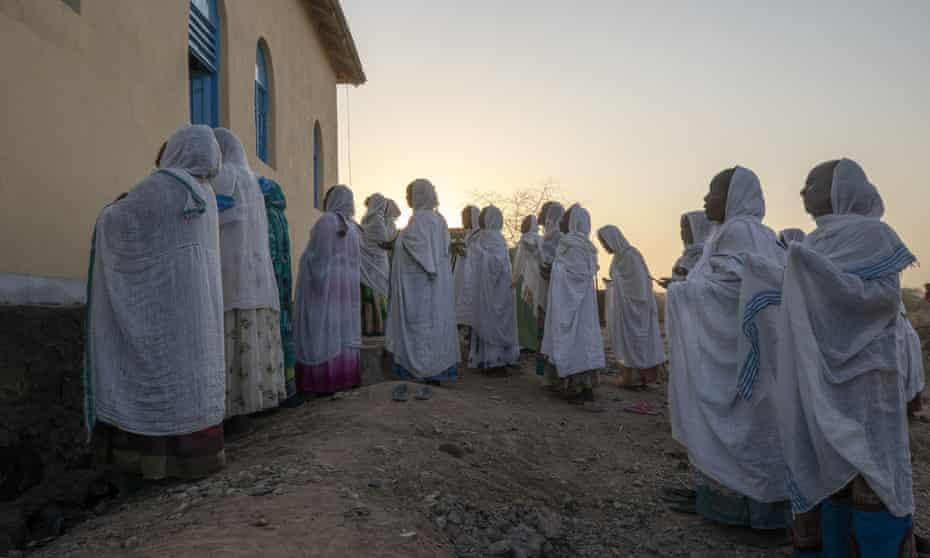 Orthodox Christian refugees who fled the conflict in Tigray pray at a camp in Hamdeyat near the Sudan-Ethiopia border.