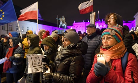 Polish people protesting in front of the presidential palace in Warsaw on 14 December against the rightwing government’s court reforms