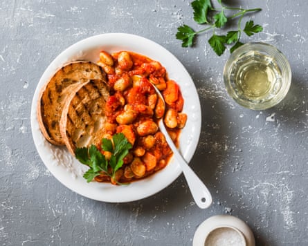 Spicy braised lima beans in tomato sauce and ciabatta toast