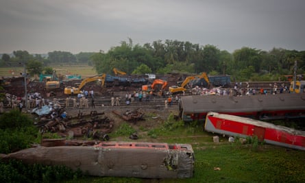 The wreckage of rail coaches in Bahanaga village.