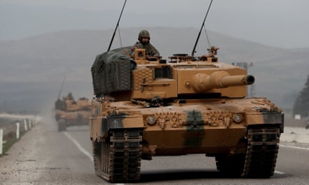 Turkish army tanks on the move near the Syrian border.