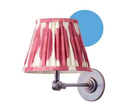 Wall lamp with a patterned pink and white lampshade.