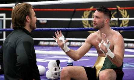 Josh Taylor discusses tactics during a training session with Ben Davison at the MTK Performance gym n Harlow.