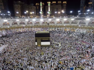 Muslim pilgrims circle the Kaaba at the Grand Mosque in Mecca