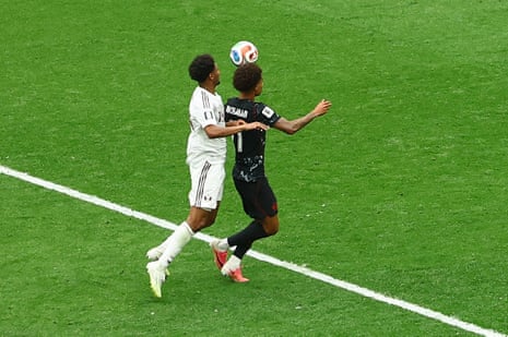 Qatar's Homam Ahmed clatters into Tajon Buchanan.