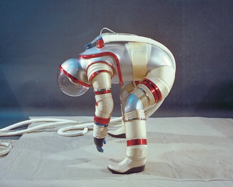Designer ‘Vic’ Vykukal models the AX-3 spacesuit at Ames Research Center in 1977. He is bending forward and attempting to touch the ground to demonstrate the suit's manoeuvrability