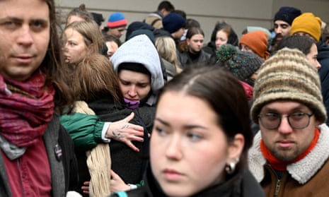 People mourn at a makeshift memorial for the victims outside the Charles University in central Prague, on December 22, 2023.
