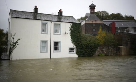 Flood defences are being deployed on homes after the River Derwent broke its banks in Cumbria, England.