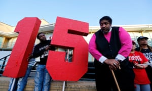 The
Rev William Barber II stands outside the National Civil Rights
Museum following a march by Fight for $15 supporters last year.