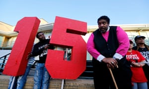 The
        Rev William Barber II stands outside the National Civil Rights
        Museum following a march by Fight for $15 supporters last year.