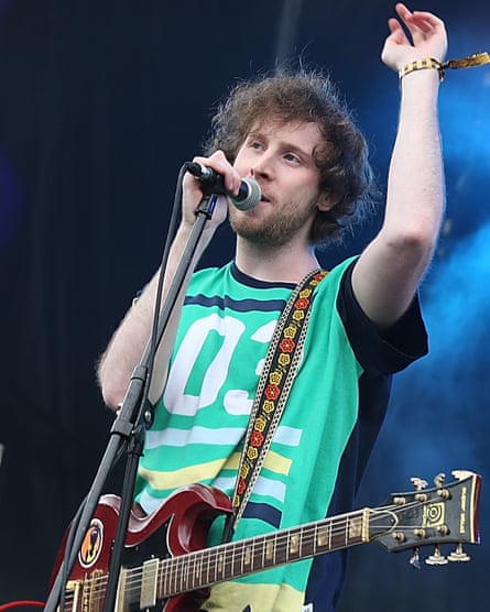 Anamanaguchi songwriter and guitarist Peter Berkman playing on stage.
