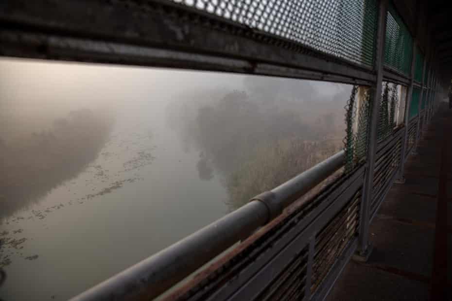 The Rio Grande flows under a dense fog at the US-Mexico border crossing on 23 February.