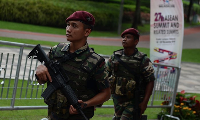 Malaysian military personnel patrol at the venue for the 27th Association of Southeast Asian Nations (ASEAN) Summit at the Kuala Lumpur Convention Centre .