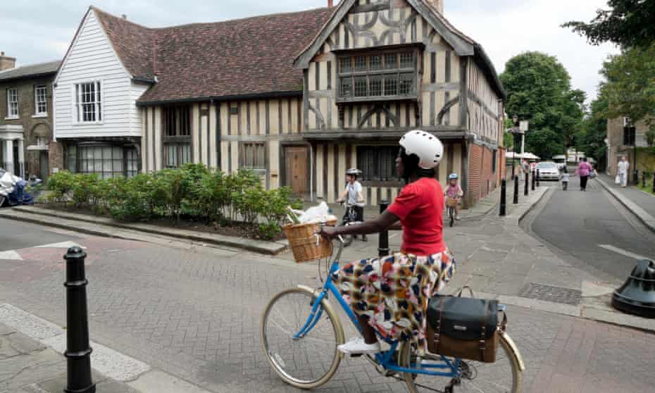 Female cyclist in Walthamstow Village, London,