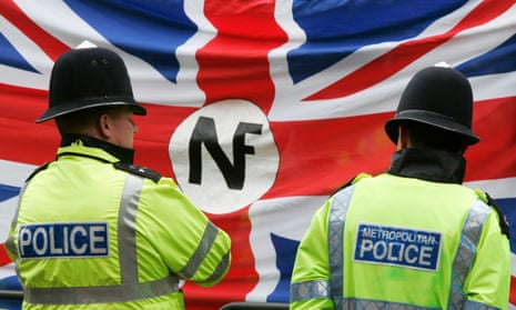 Police watch a demonstration by the far-right National Front in London