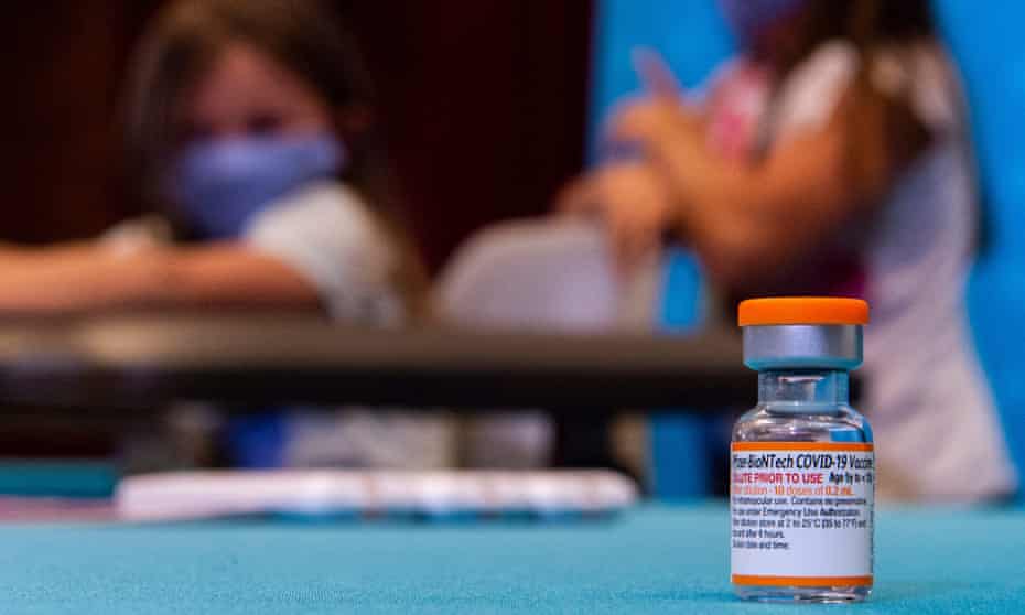 A vial of the children’s dose of Pfizer’s Covid vaccine is seen on a table. 
