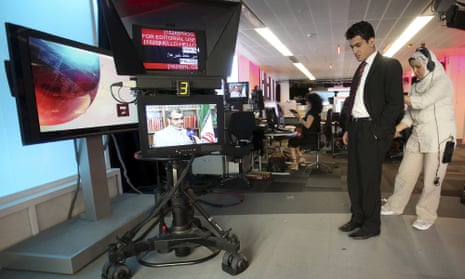 Fardad Farahzad, a presenter for BBC Persian, prepares to read the news