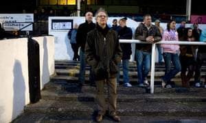 Ken Loach standing on the terraces of Bath City football club.