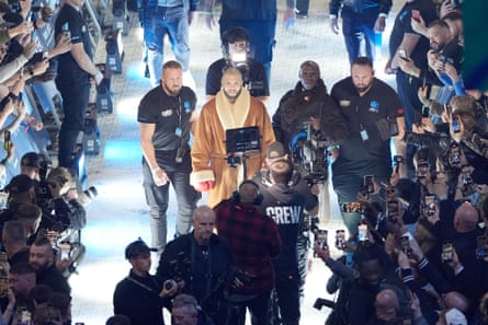 Chris Eubank Jr and Chris Eubank Sr walk out ahead of the middleweight bout between Chris Eubank Jr and Conor Benn.