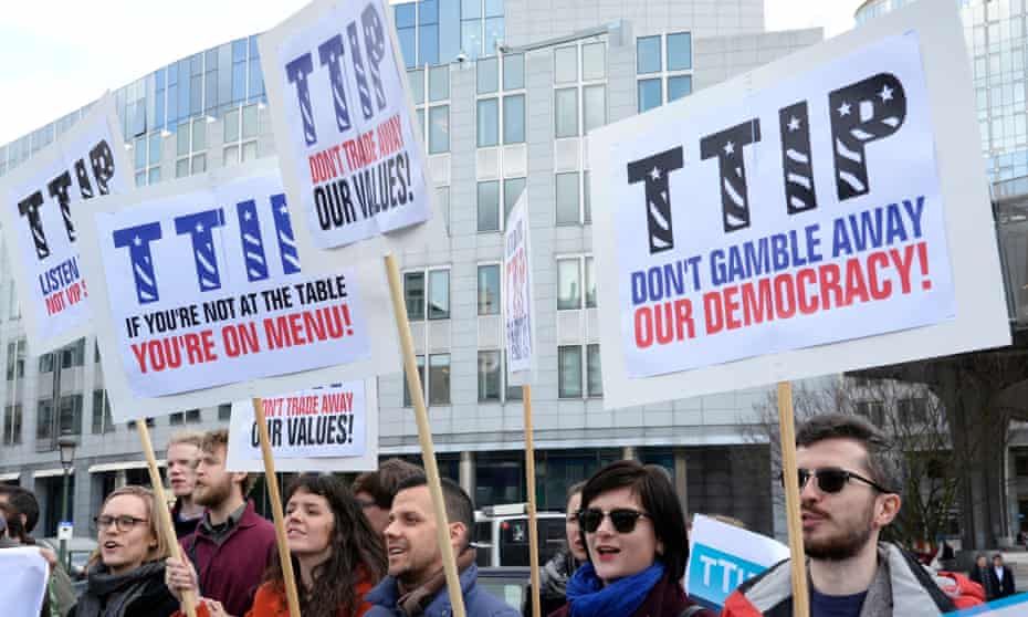People protest against the Transatlantic Trade and Investment Partnership (TTIP) between the EU and US outside the European parliament in Brussels