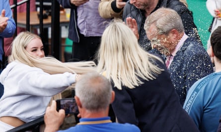 A woman throwing a milkshake at Nigel Farage during his general election campaign launch in Clacton-on-Sea on 4 June.