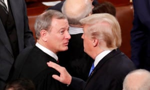 Donald Trump talks with John Roberts after his State of the Union address in January.