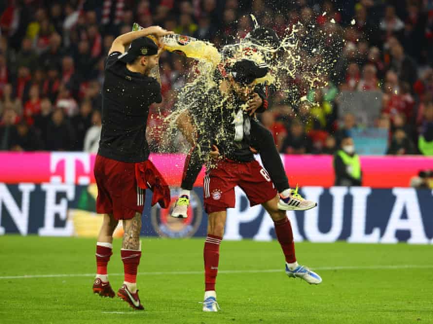 Bayern Munich's Leon Goretzka celebrates with teammates after winning the Bundesliga.