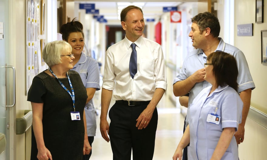 Simon Stevens (centre) is talking to staff at at Shotley Bridge hospital in County Durham.