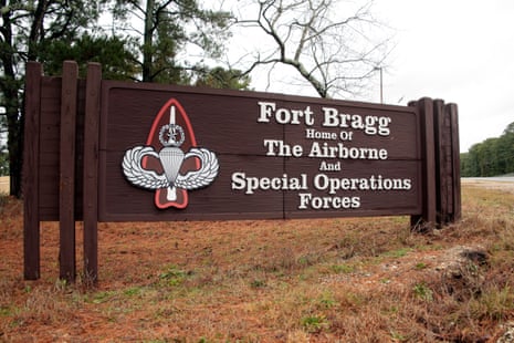 A large wooden Fort Bragg sign reads 'Home of The Airborne and Special Operations Forces'
