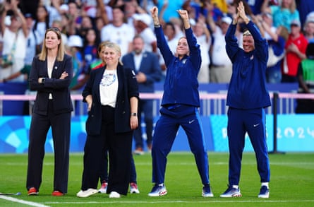 Emma Hayes (second left) and her coaching staff celebrate after beating Brazil in Paris