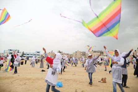 Girls flying kites