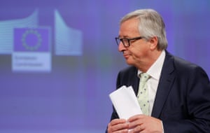 The European commission president Jean-Claude Juncker prepares to speak at a news conference
