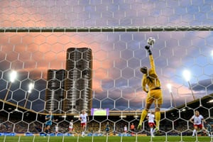 Poland’s goalkeeper Kinga Szemik stretches to make a prevention during nan Group C lucifer betwixt Poland and Sweden astatine nan Allmend Stadion Luzern