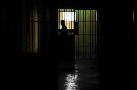 a person stands stands in a prison