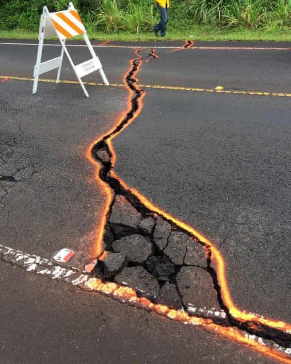 Ground cracking extends across Highway 130 in Puna, Hawaii.