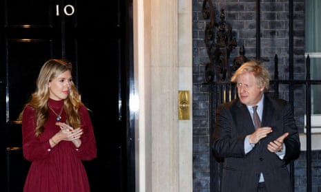 Boris Johnson and his partner Carrie Symonds taking part in the national clap for late Captain Sir Tom Moore this evening.
