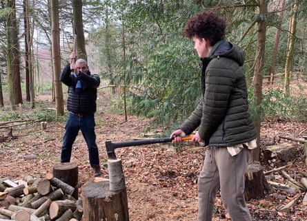 The writer and his son chopping wood