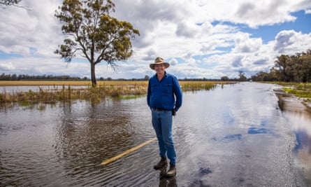 Cattle farmer Charles Laverty spent Thursday sandbagging his property on the outskirts of Forbes, where about one-third of his paddocks are underwater.