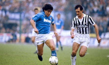 Maradona goes up against Juventus’s Luigi De Agostini during his time at Napoli