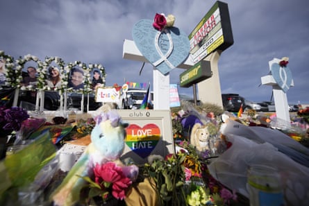 Flowers, crosses and stuffed animals on the floor