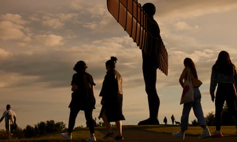 People walk past the Angel of the North statue in Gateshead. Many people from the north of England said their accent had been criticised or highlighted.