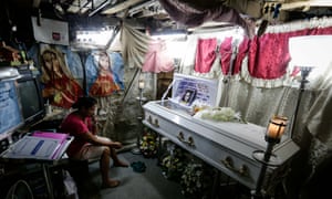 Kimberly Sailog, mourns her 12-year-old daughter Kristine, who was killed by a stray bullet in a church car park.