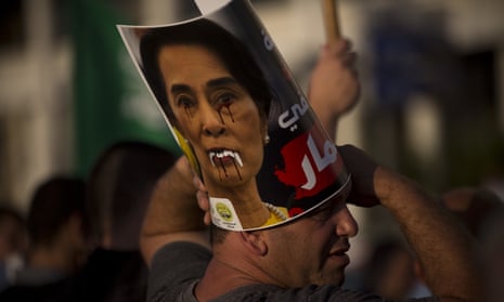 A defaced poster of Aung San Suu Kyi during a demonstration to condemn Myanmar’s treatment of the Rohingya.