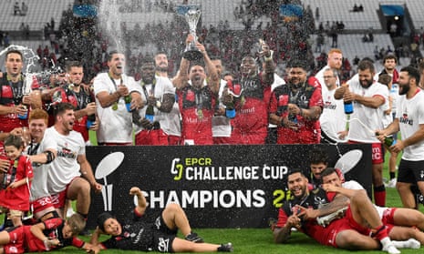 Lyon’s players celebrate after their European Challenge Cup triumph.